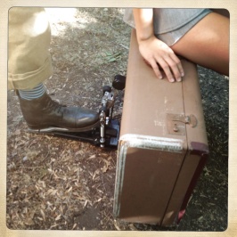 Photo of a shoe operating a kick drum pedal on a suitcase with Daphne Chen